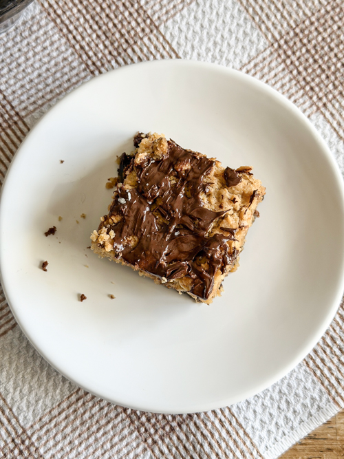 Indulge in these decadent Layered Peanut Butter Brownie Bars with chewy oatmeal, rich chocolate, and gooey peanut butter layers. Perfect for anytime treats!