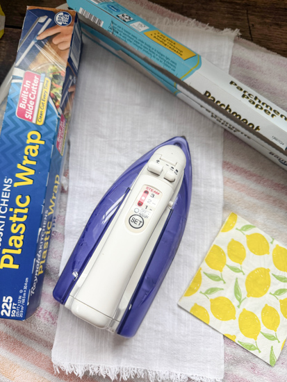 Learn how to decoupage fabric with napkins using an easy iron-on method, no glue needed! Create custom placemats, ribbon, and more with this DIY.