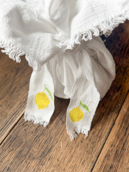 Learn how to decoupage fabric with napkins using an easy iron-on method, no glue needed! Create custom placemats, ribbon, and more with this DIY.