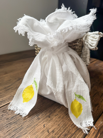 Learn how to decoupage fabric with napkins using an easy iron-on method, no glue needed! Create custom placemats, ribbon, and more with this DIY.
