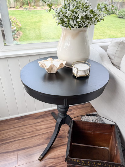 Learn how to complete a vintage table makeover with this easy tutorial. Black paint, simple prep, and easy instructions create a modern, timeless finish.