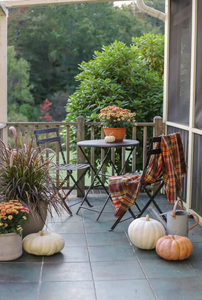 Fall Porch Decorating Ideas for every type of space! Get inspiration for front, small, back, screened, and three-season porches with cozy fall decor ideas.