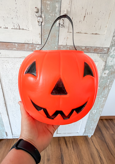 Vintage plastic pumpkin buckets are one of my favorite Halloween thrift finds. Learn how to identify them, where to find them, and how to decorate with them.