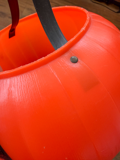 Vintage plastic pumpkin buckets are one of my favorite Halloween thrift finds. Learn how to identify them, where to find them, and how to decorate with them.