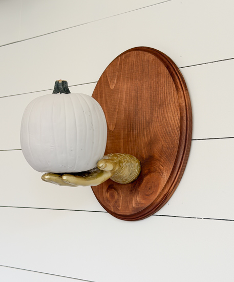 DIY Dollar Store Halloween Decoration tutorial using Dollar Tree supplies to make a unique pumpkin holder wall hanging that looks high-end for less.