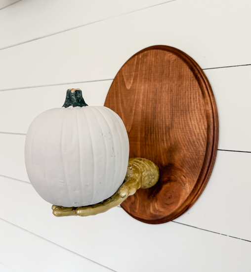 DIY Dollar Store Halloween Decoration tutorial using Dollar Tree supplies to make a unique pumpkin holder wall hanging that looks high-end for less.