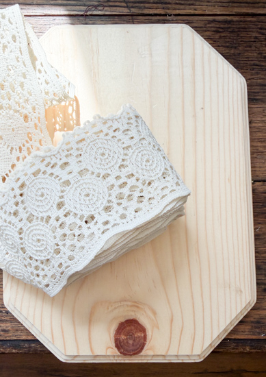 DIY Halloween Ghost Decor is easy to make with a wood plaque, lace trim, and a few simple supplies. Create this cute DIY ghost wall hanging on a budget.
