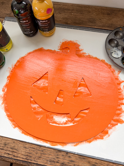 Create vintage Halloween wall decor with inexpensive Dollar Tree pumpkin cutouts and paint. See how easy it is to get the vintage look for less.