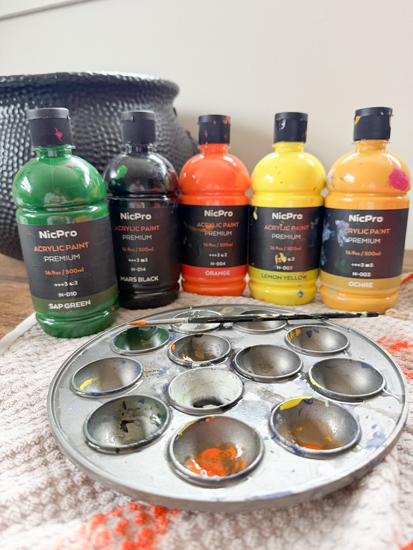 Create vintage Halloween wall decor with inexpensive Dollar Tree pumpkin cutouts and paint. See how easy it is to get the vintage look for less.